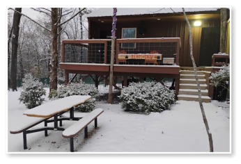 One of our cabins covered in snow